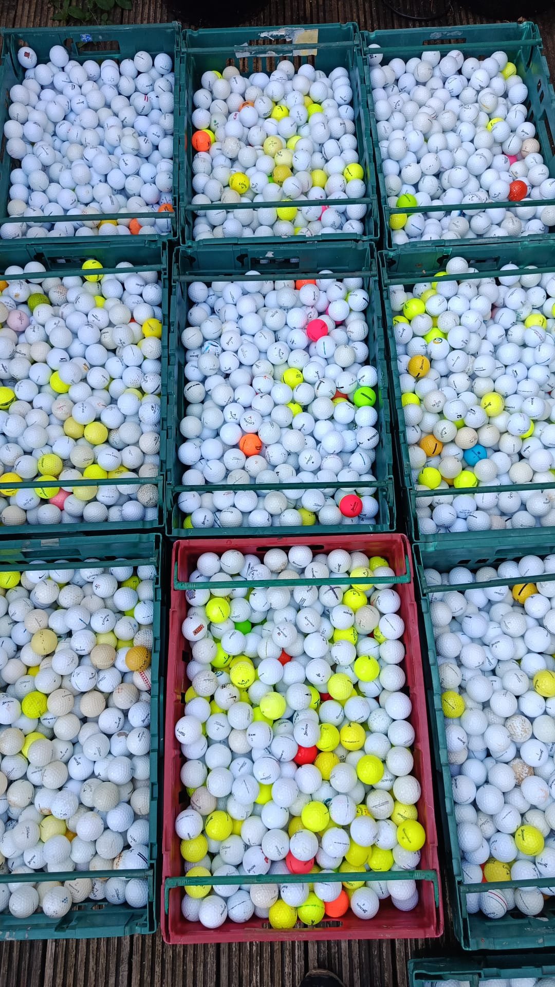 Crates of used golf balls we buy