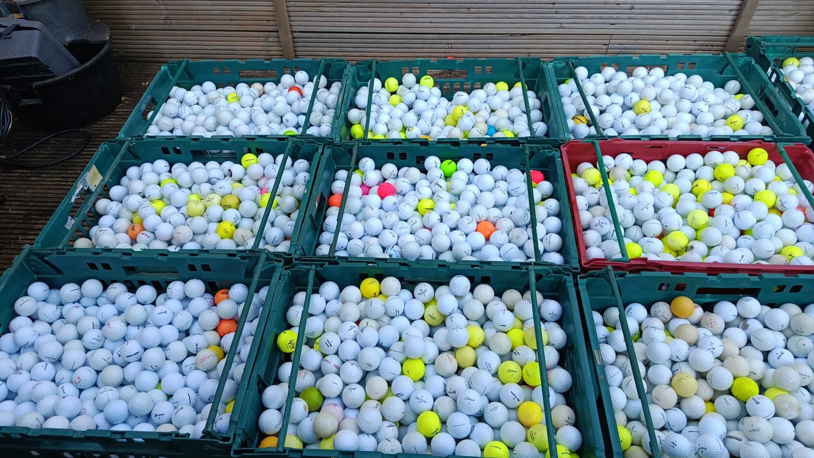 Trays of used golf balls